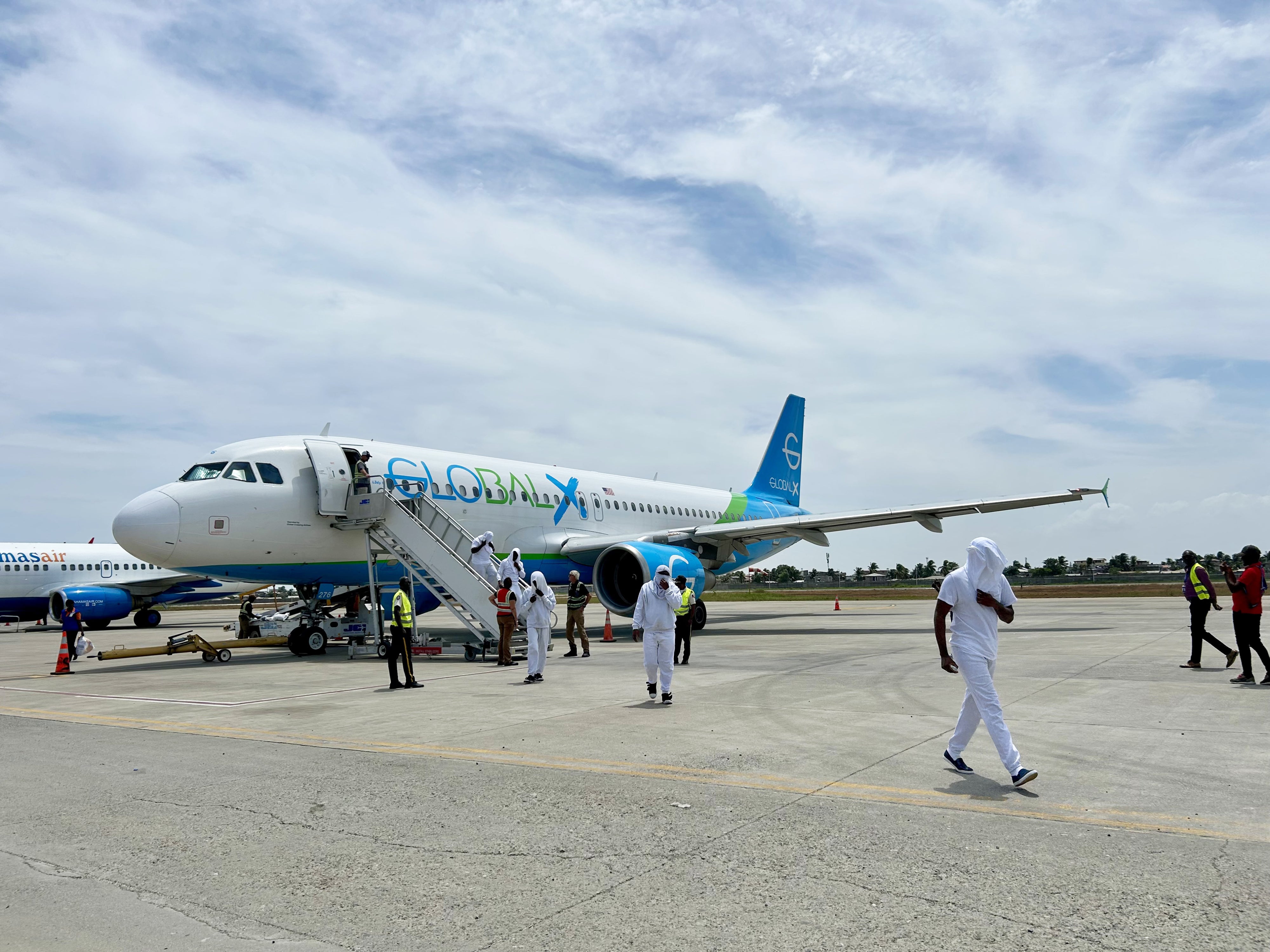 Haitians deported from the United States disembark from a charter flight at Cap-Haïtien International Airport, Haiti, August 27, 2026.