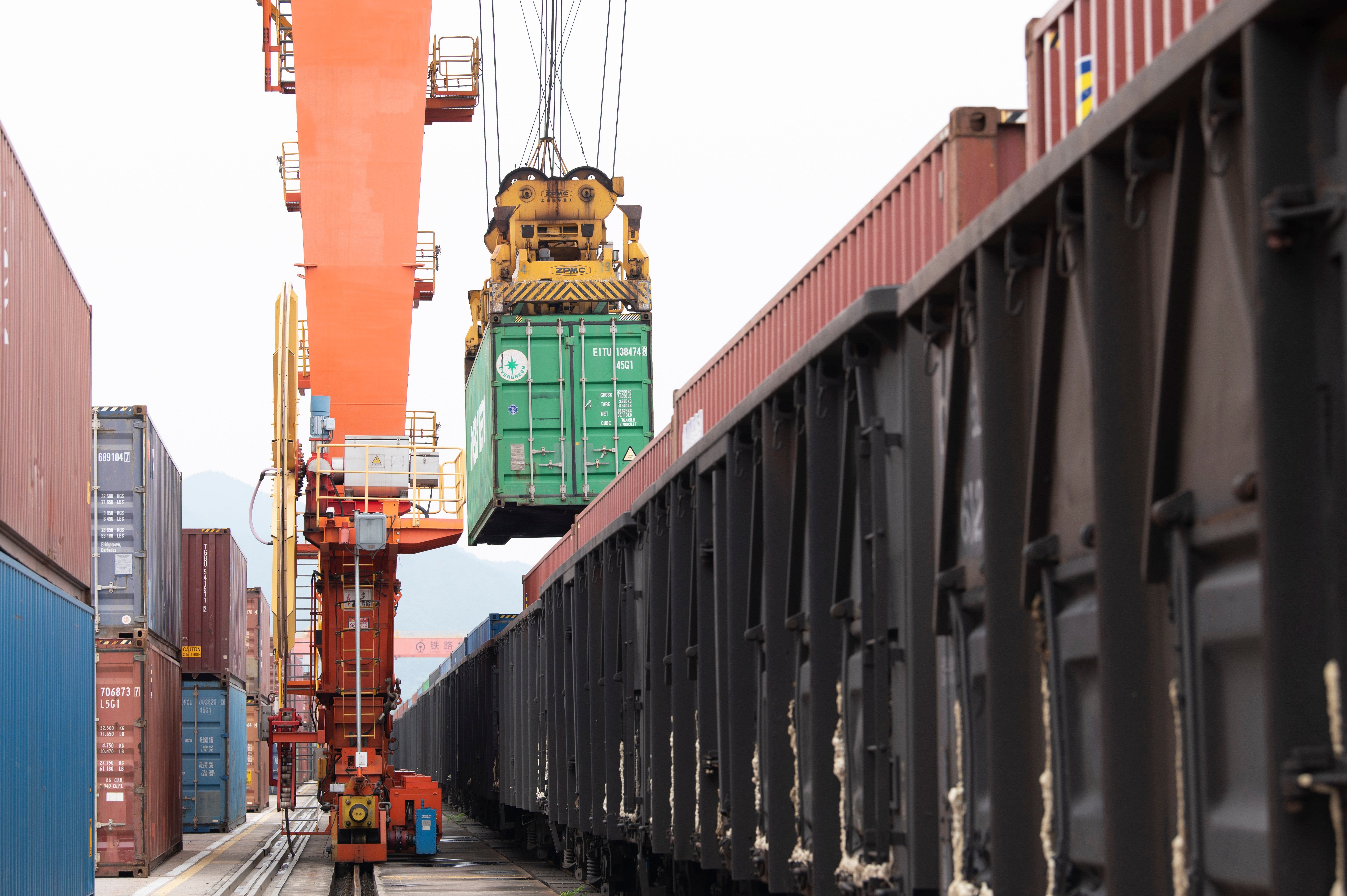 Containers are loaded onto a China-Europe Railway Express (Yiwu-Xinjiang-Europe) market procurement train at the Jinhua Yiwu Railway West Station in Jinhua, China, on June 8, 2026.