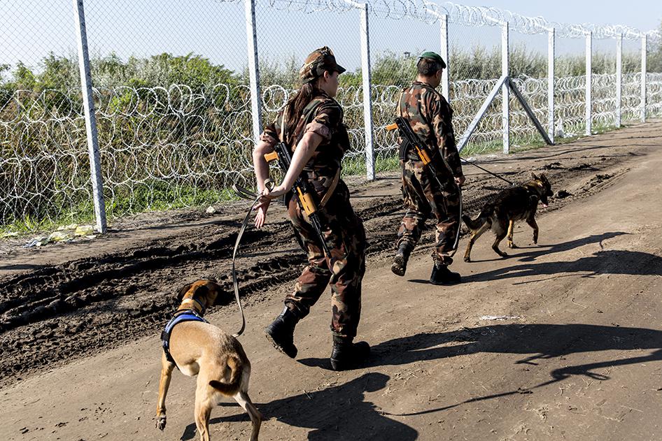 2015-9-eca-hungary-officers-fence