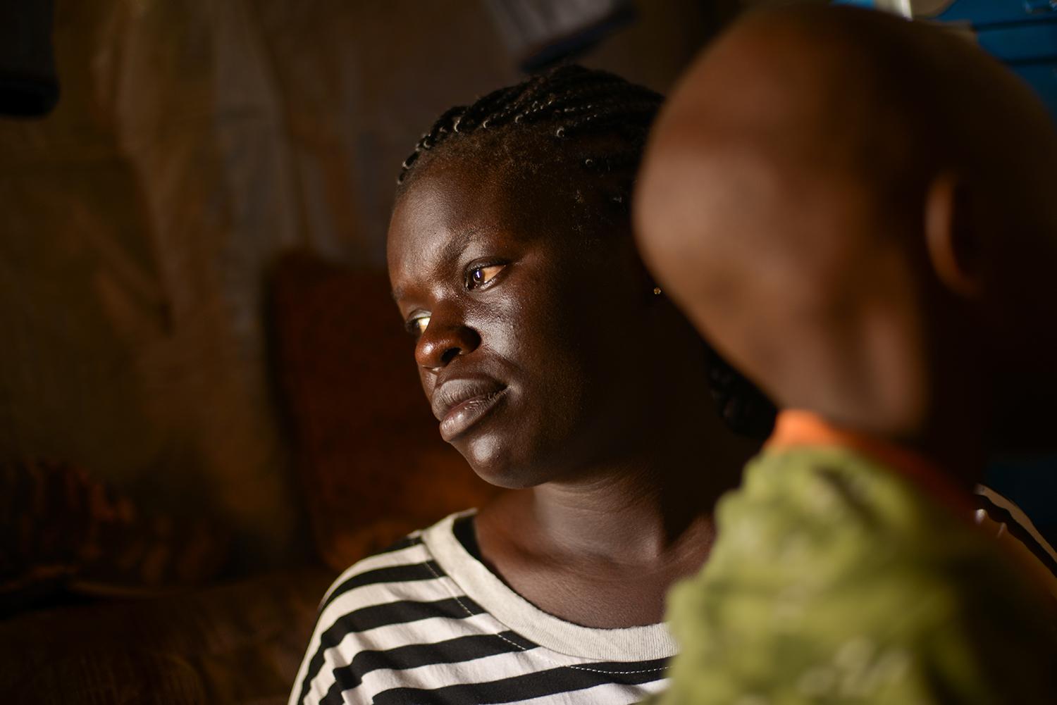 Fatma W. with her 7-year old son born from rape.