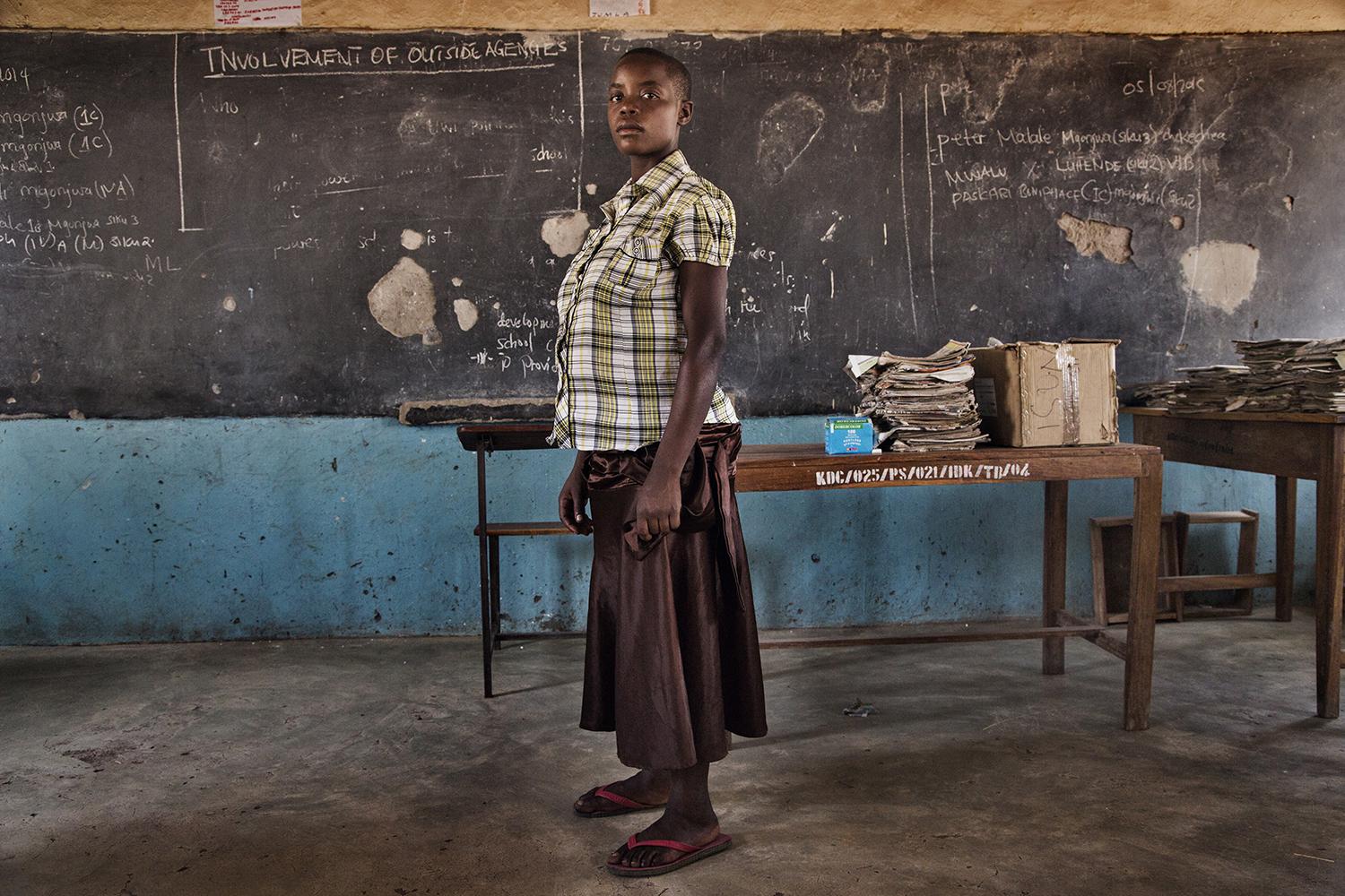 Jacinta, 15, was excluded from school after authorities found out that she was pregnant. She said her teachers took her to a medical clinic to undergo a pregnancy test. She subsequently gave birth prematurely and her baby did not survive. August 5, 2014.