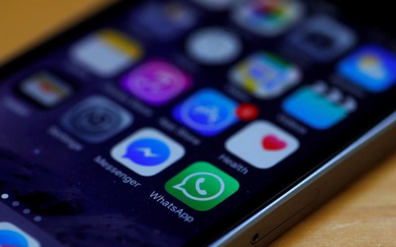 WhatsApp and Facebook messenger icons are seen on an iPhone in Manchester , Britain March 27, 2017.