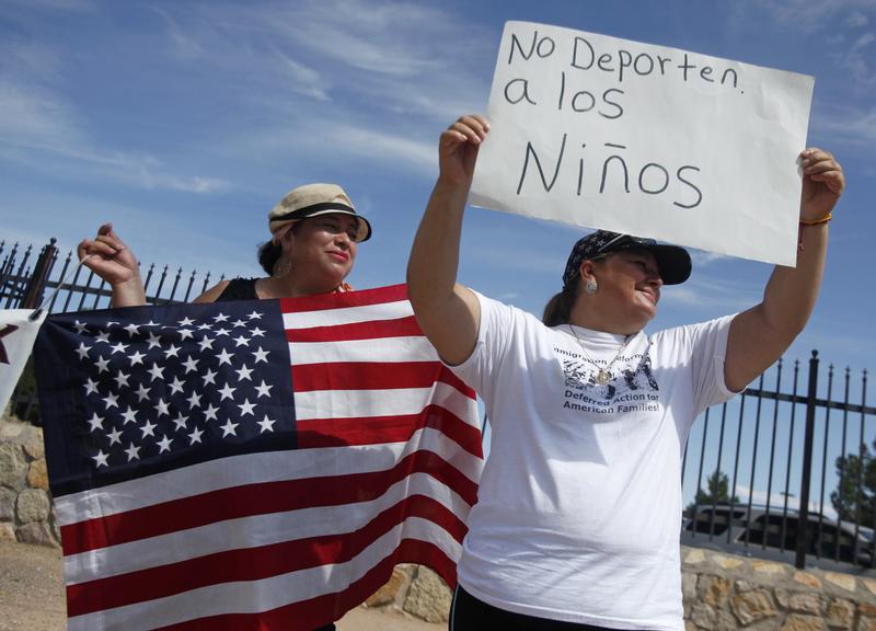 Border residents and members of the Border Network for Human Rights (BNHR) protest to reject border militarization and the deportation of children, outside a detention center in Montana, Texas August 24, 2014.
