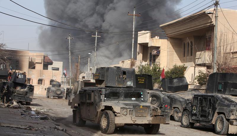 Smoke rises from an airstrike during a battle with Islamic State militants in the Tahrer neighborhood of Mosul, Iraq on January 10, 2017.