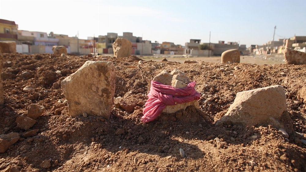 A cluster of 15 graves dug by family members in Samah neighborhood after an ISIS car bomb targeting Iraqi Security Forces on November 6, 2016 killed 23 civilians.