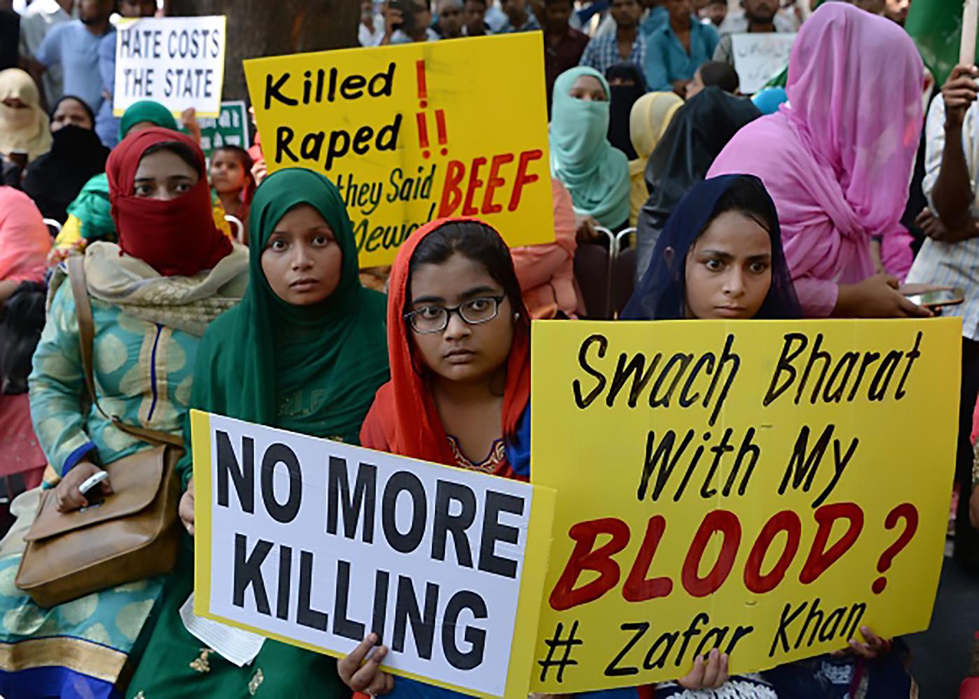 Indian demonstrators hold placards as they take part in a rally in New Delhi on July 18, 2017, in protest over a spate of assaults against Muslims and low-caste Dalits by Hindu vigilantes in India. /