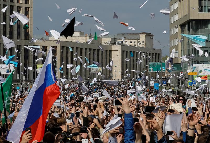 ople release paper planes, symbol of the Telegram messenger, during a rally in protest against court decision to block the messenger. 