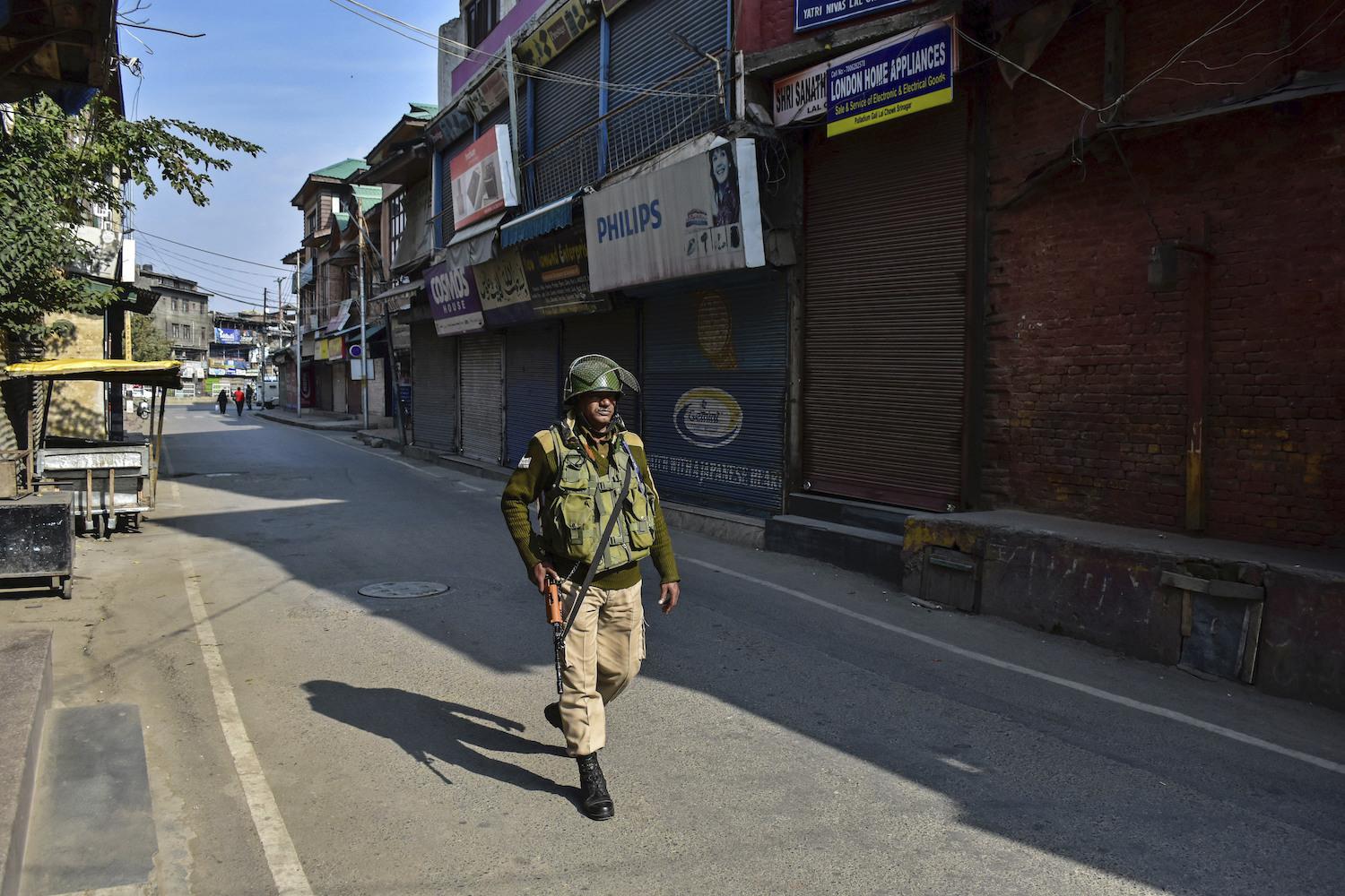 A paramilitary trooper patrols a street during the shutdown.