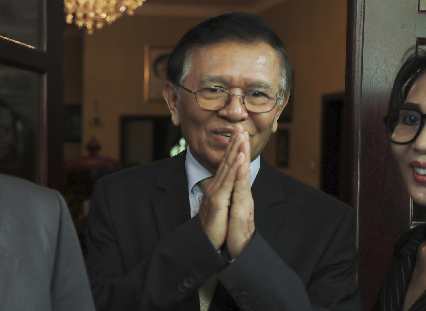 Cambodia National Rescue Party's President Kem Sokha greets media after a meeting with French Ambassador to Cambodia Eva Nguyen Binh at his house in Phnom Penh, Cambodia, Monday, Nov. 11, 2019. 
