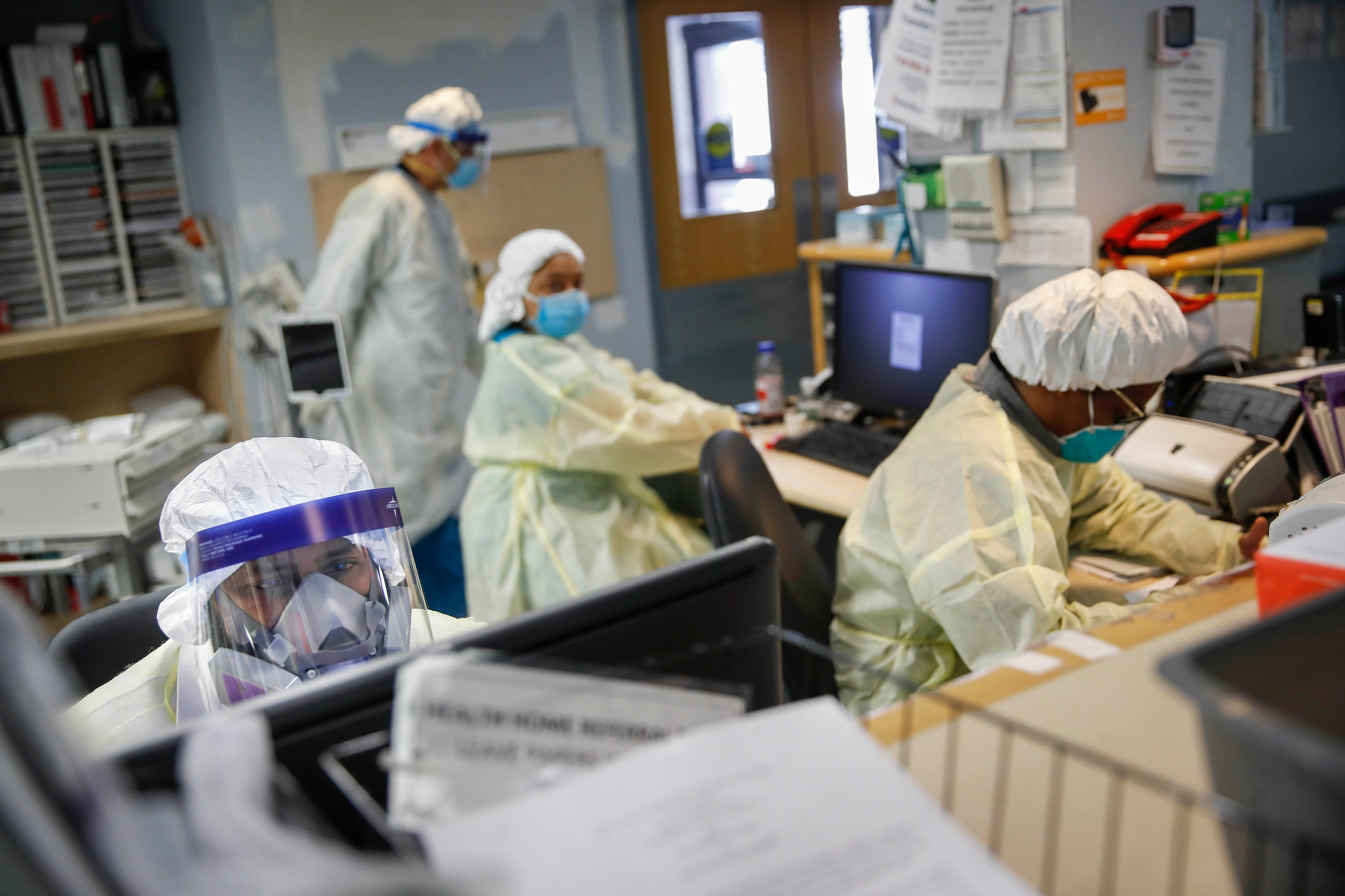Hospital workers wear protective gear