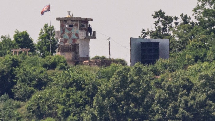 A North Korean soldier on a watch tower on the edge of the demilitarized zone dividing North Korea and South Korea, June 12, 2025.