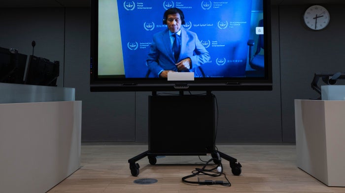 Former Philippine President Rodrigo Duterte is seen on a screen in the courtroom of the International Criminal Court, in The Hague, Netherlands, March 14, 2025.  
