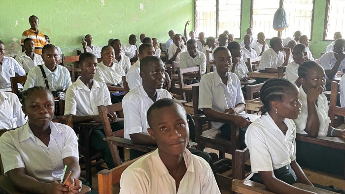 Students seated at their desks in a classroom