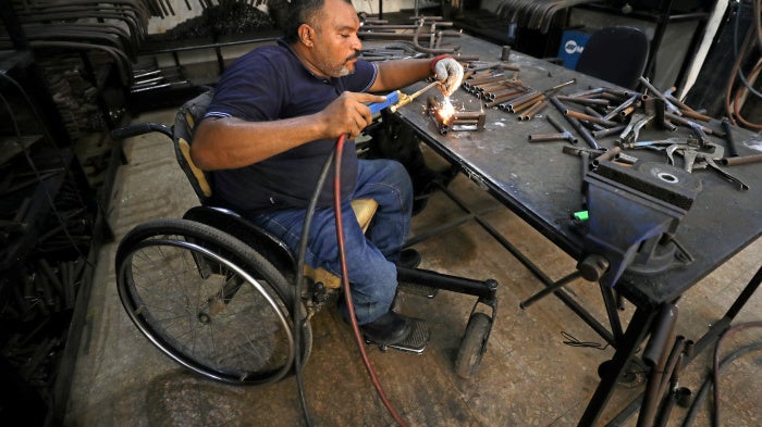 A man with a physical disability builds mobility products for underserved communities in Cairo, Egypt, August 8, 2017.