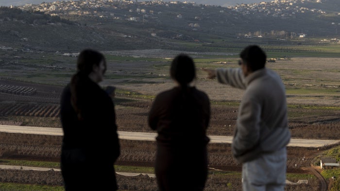Israelis look at the border with Lebanon from a position in the northern village of Metula on March 5, 2026, after Hezbollah launched rockets at Israel during the ongoing conflict.
