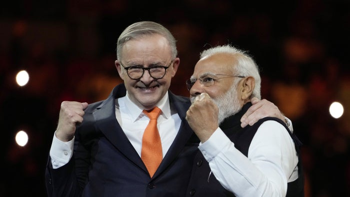 Australian Prime Minister Anthony Albanese (left) and Indian Prime Minister Narendra Modi  during an Indian community event at Qudos Bank Arena in Sydney, Australia, May 23, 2023.
