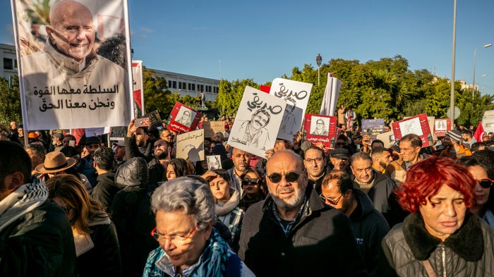 People rally calling for the release of political detainees and greater freedom of expression in Tunis, Tunisia, on December 6, 2025.