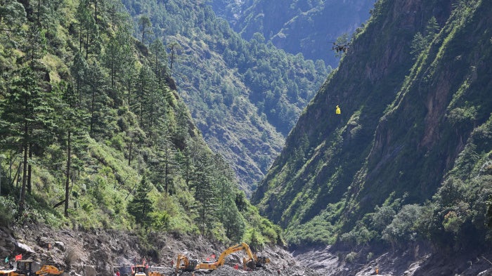 Rescue workers use drones to deliver supplies at Gyirong Port in Tibet, August 28, 2026.