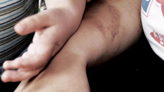 A woman and child at a shelter for victims of domestic violence in Hungary, October 10, 2013.