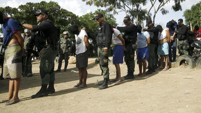 Venezuelan soldiers detain men who allegedly had links to a Colombian paramilitary group during an OLP raid in Táchira state, Venezuela  ©2015 Carlos Eduardo Ramirez/Reuters