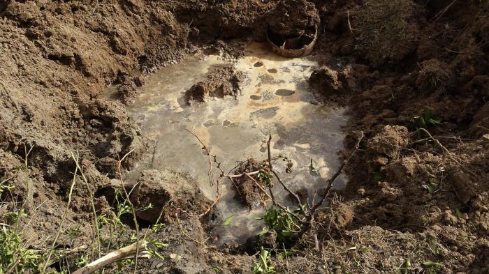 Remnant of a weapon that struck the town of Qayyarah on September 21, 2016 and photographed that day. The chemical agent inside has been diluted with water by local residents.