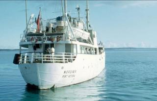 An archival photo of a boat at sea
