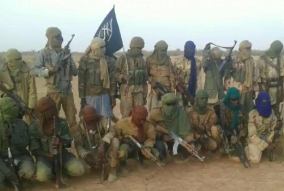 A group of armed men pose for a photo