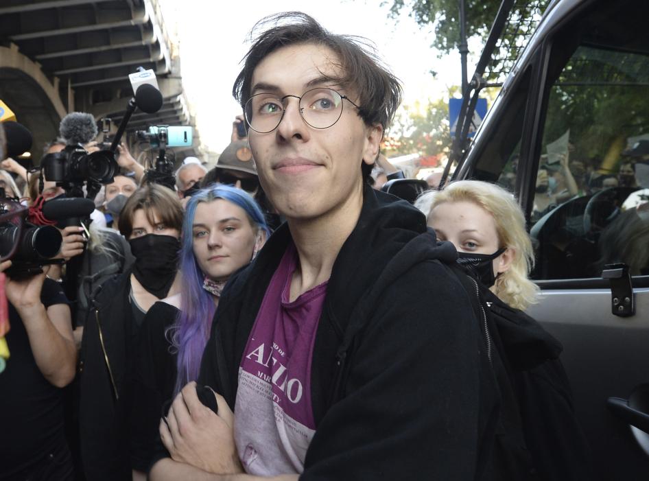 Activist Malgorzata Szutowicz, center, known as Margot, before being arrested in Warsaw, Poland,