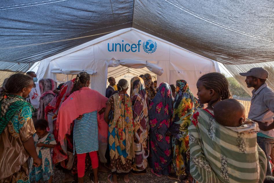 People who fled the conflict in Ethiopia's Tigray region wait to receive treatment at a clinic run by Médecins Sans Frontières (MSF) in Village 8 transit center near the Lugdi border crossing, eastern Sudan, December 8, 2020. 