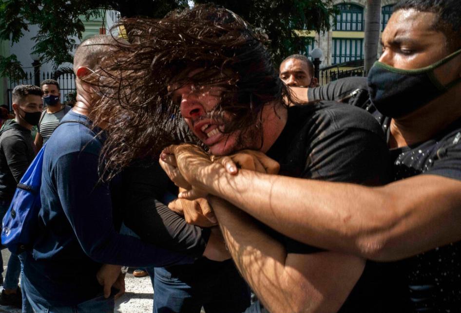 Plainclothes officers detain a protester during a protest in Havana, Cuba, Sunday, July 11, 2021. 