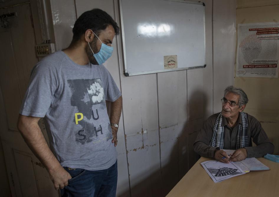 Khurram Parvez, a prominent human rights activist, left, in the office of the Jammu and Kashmir Coalition of Civil Society in Srinagar, India, August 25, 2020. 