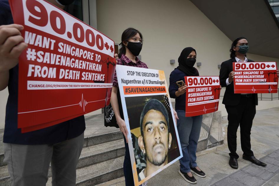 A group of people holding protest signs