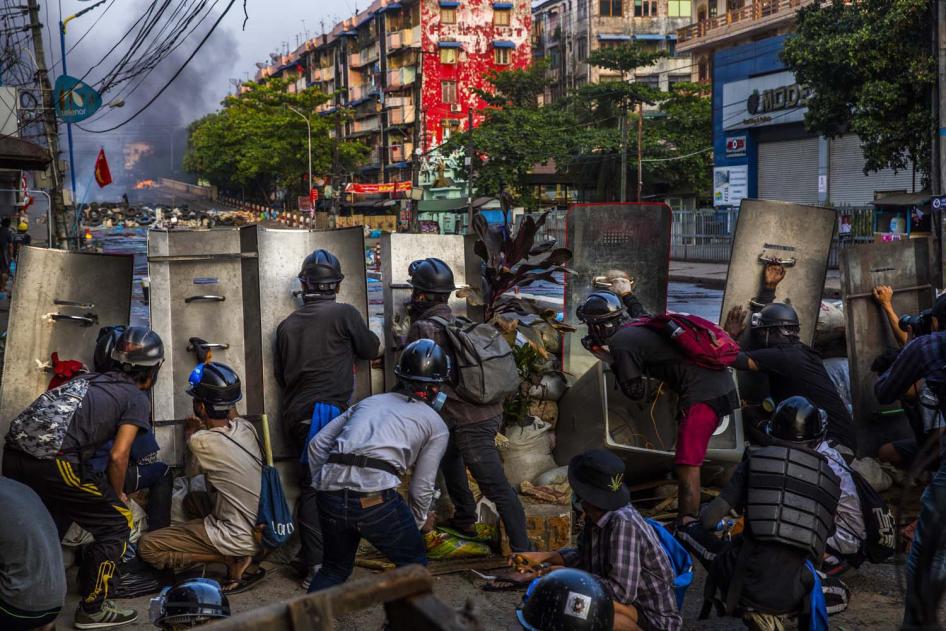 Protestors defend their makeshift barrier