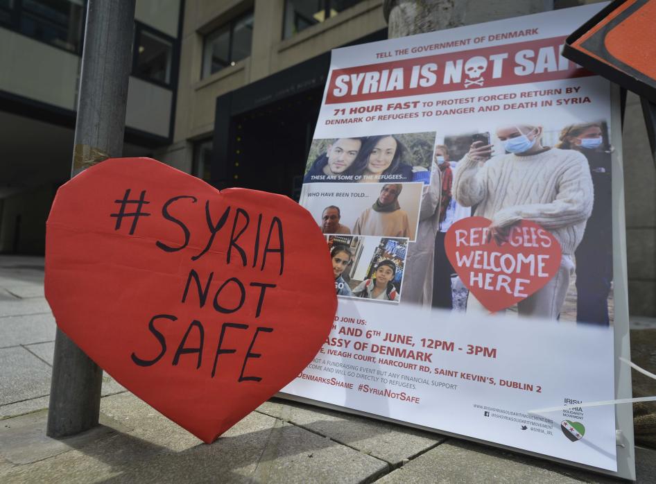 A protest sign that reads "#Syria Not Safe"