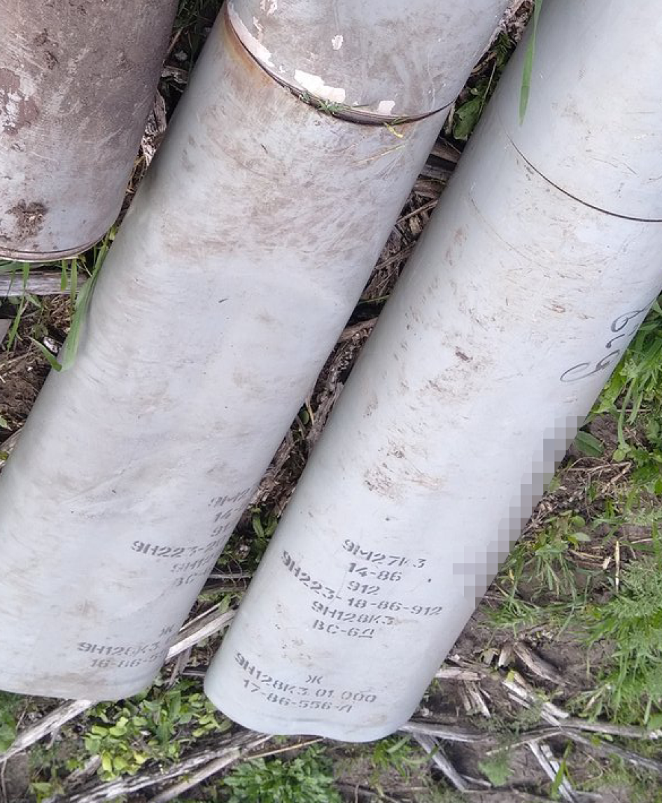 A photo posted on social media in May 2023 taken by an individual in eastern Ukraine showing two 9N128K3 warhead sections of 9M27K3 Uragan 220mm rockets, which exclusively carry and disperse PFM-1S antipersonnel blast mines. A phrase written in Ukrainian on one of the rockets says, “Від,” which translates as “from,” and Latin script that identifies a Ukrainian business. Human Rights Watch has blurred the name of the company written on the rockets and cropped the image to protect its identity. 