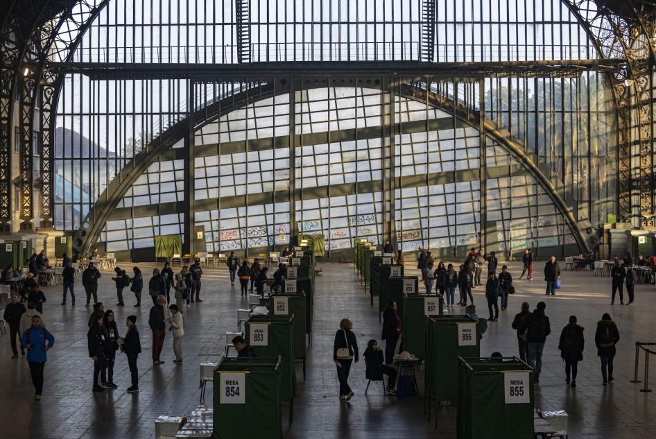People vote at the former Mapocho train station, now a cultural center, during an election to choose members of a council to draft a proposed new constitution, Santiago, Chile, May 7, 2023. 
