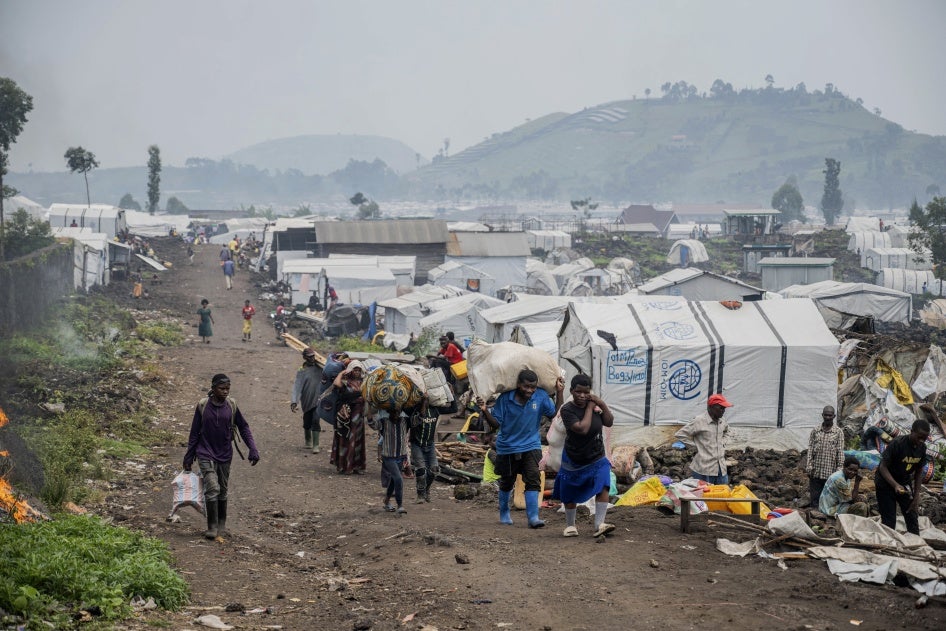 People leaving an IDP camp near Goma.