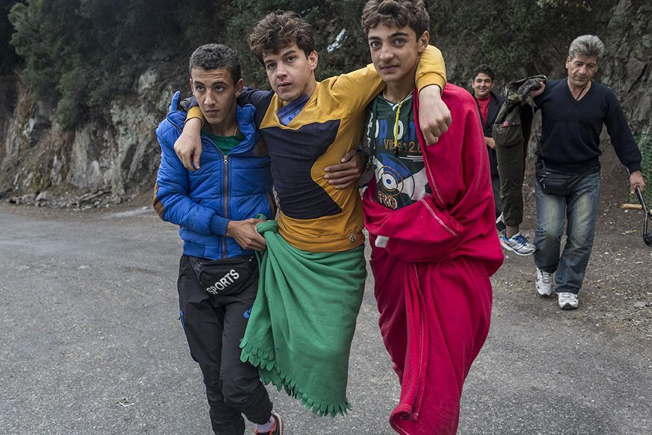 18-year-old Mohammed, who said he lost both legs to a Syrian airstrike in Idlib in 2012, is carried by friends on the island of Lesbos in Greece. Both his friends and parents accompanied him on his journey to safety, carrying him whenever needed.