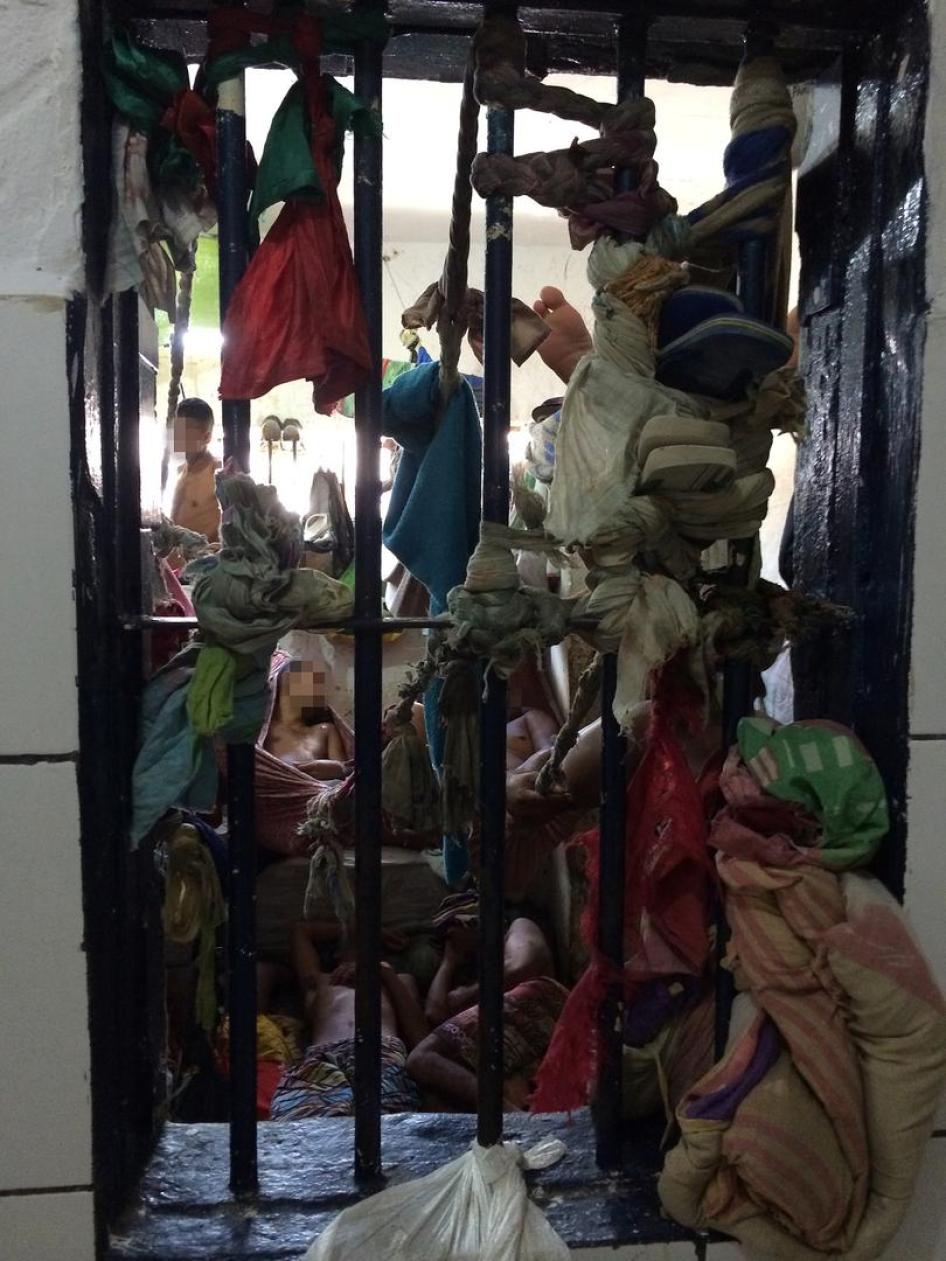detainees in a cell