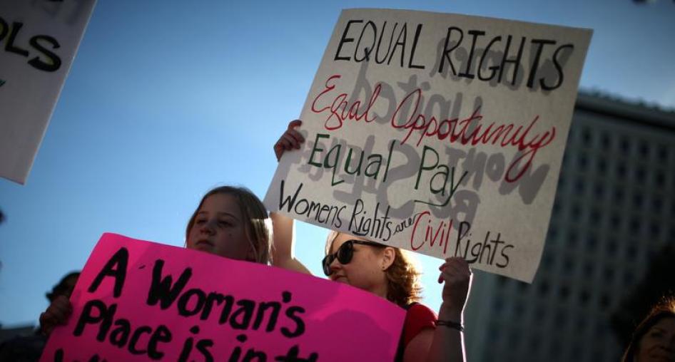 A mother and her daughter participate in the International Women's Day "A Day Without a Woman" protest in Los Angeles, California, U.S., March 8, 2017.