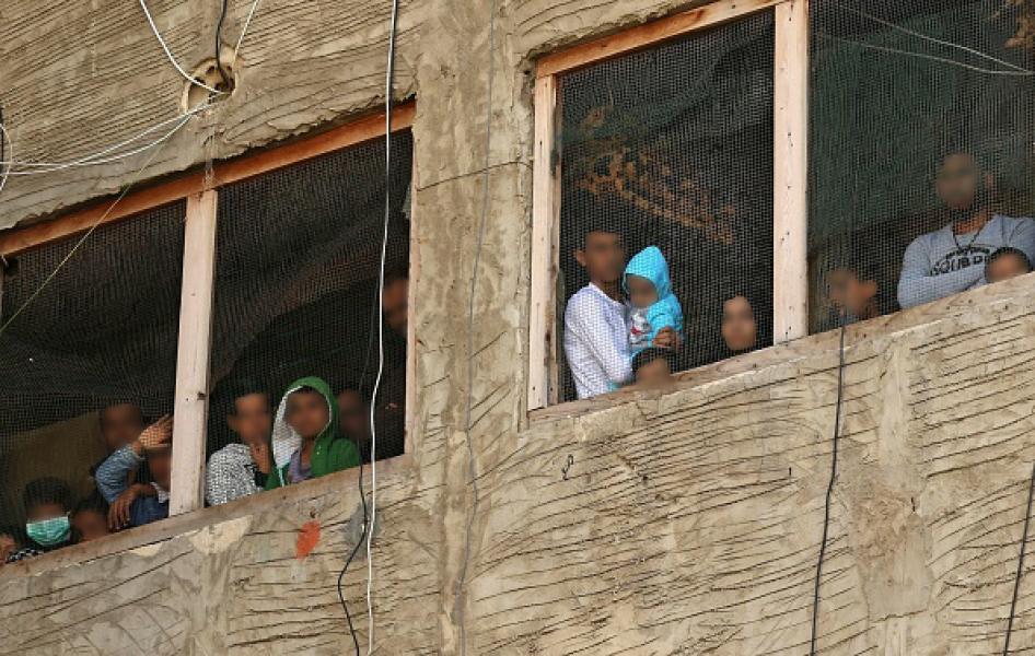 Syrian refugees in a building under construction they have been using as a shelter in a city in southern Lebanon, on March 17, 2020, after Lebanon urged people to stay at home for two weeks to stem a novel coronavirus outbreak.  