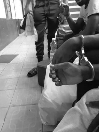 202201us_cameroon_handcuffs