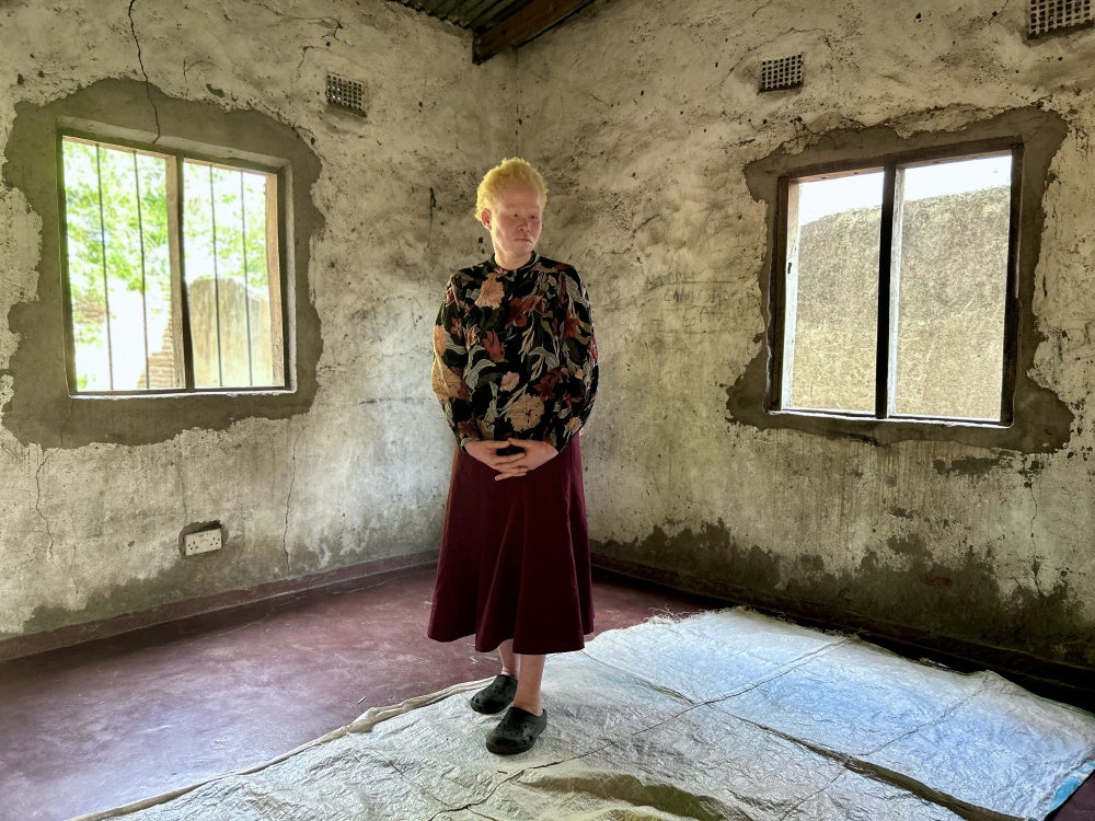 Awese, 40, in her home in Mangochi district, Malawi. 