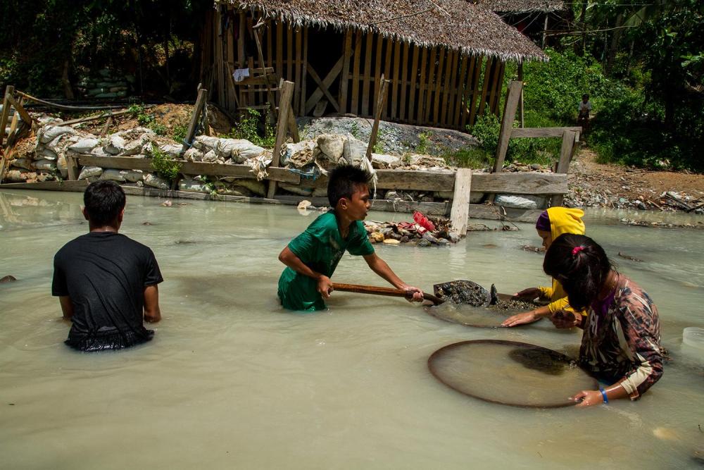 Children pan for gold