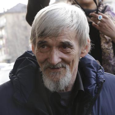 Historian Yuri Dmitriev, who was on trial on charges of involving his adopted daughter in child pornography, of illegally possessing components of a firearm, and of depravity involving a minor, speaks with people after a hearing outside a court building in Petrozavodsk, Russia. April 5, 2018.