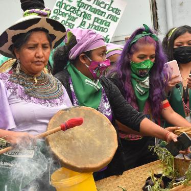 A group of women protesters playing drums