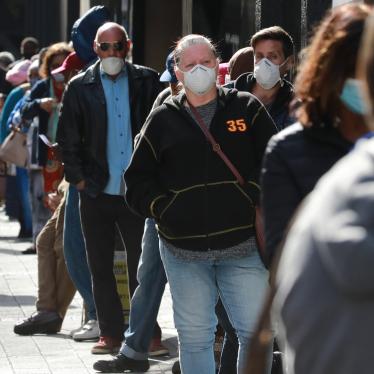 People standing in line to receive benefits at a South African Social Security Agency building in Cape Town, South Africa.