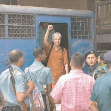 Adilur Rahman Khan, when police brought him to court on August 11, 2013. He was detained by police the prior evening and his whereabouts were kept unknown until he was brought to court.