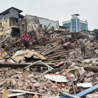 People clean debris from damaged buildings in the aftermath of an earthquake on March 28, in Naypydaw, Myanmar, April 7, 2025.