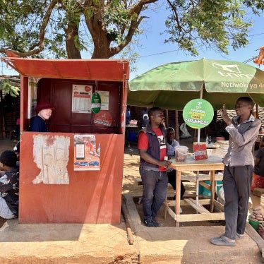 Maureen Kamatu, 28, has been self-employed at a mobile money cash-transfer booth in Lilongwe, Malawi. 